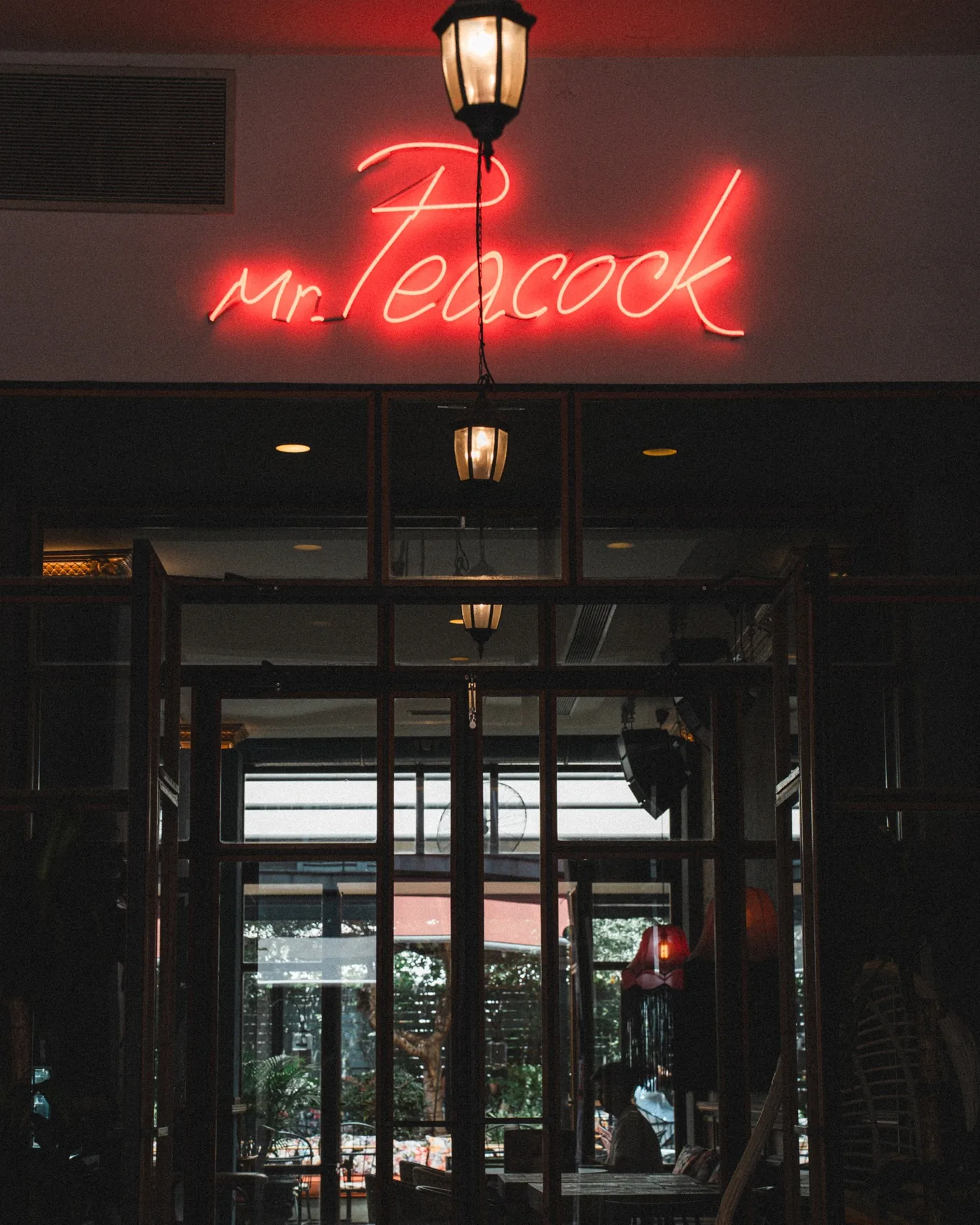 The Mr. Peacock neon above the door