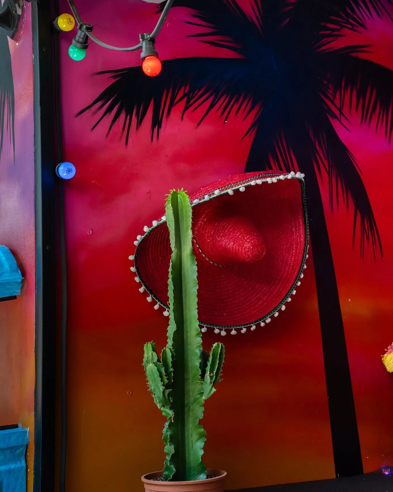 Red neon, palm and cactus