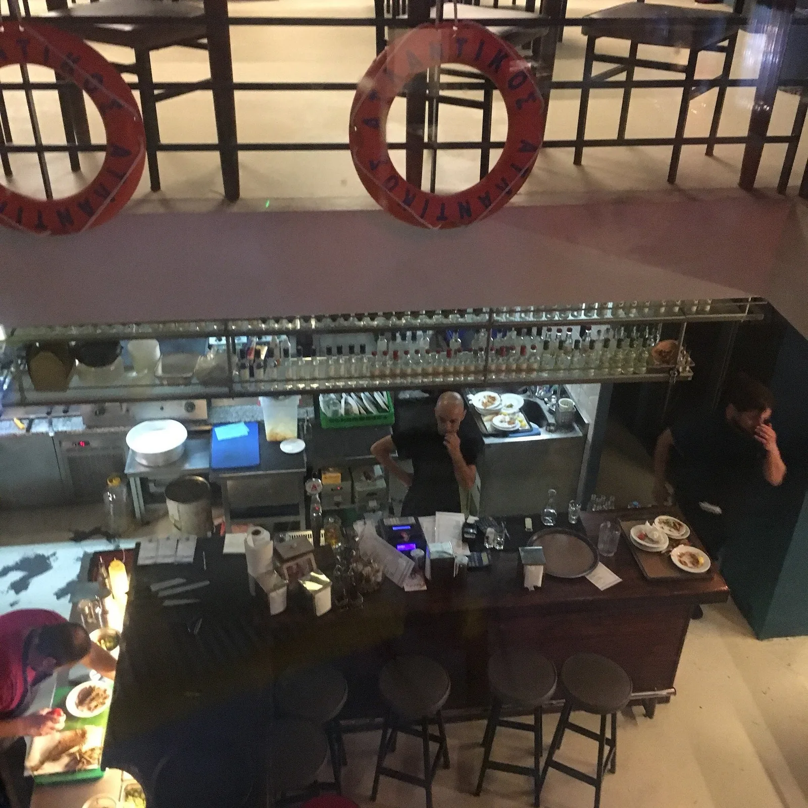 Inside the taverna — a full, happy room